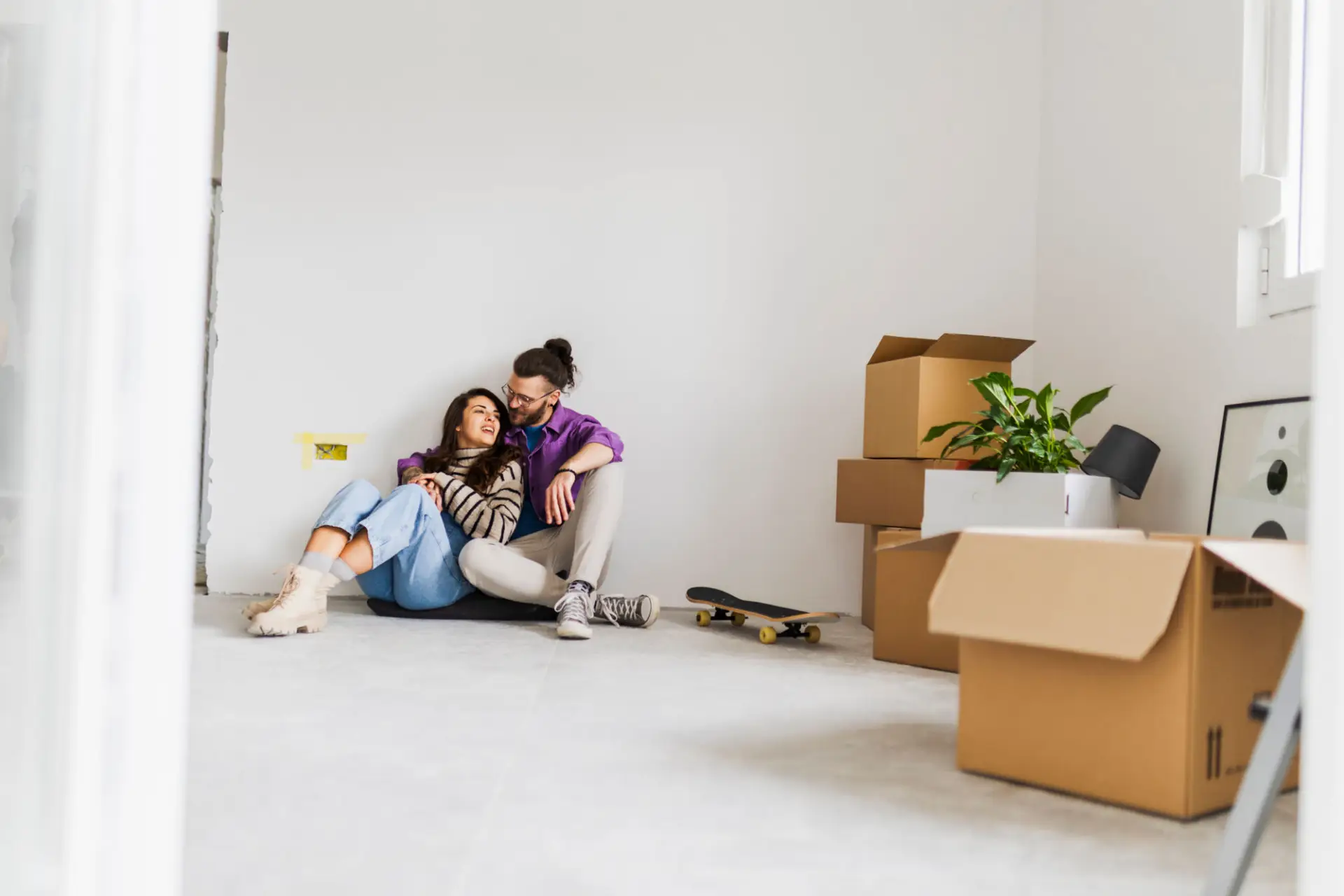 Portrait Of Happy Couple Moving To New Home