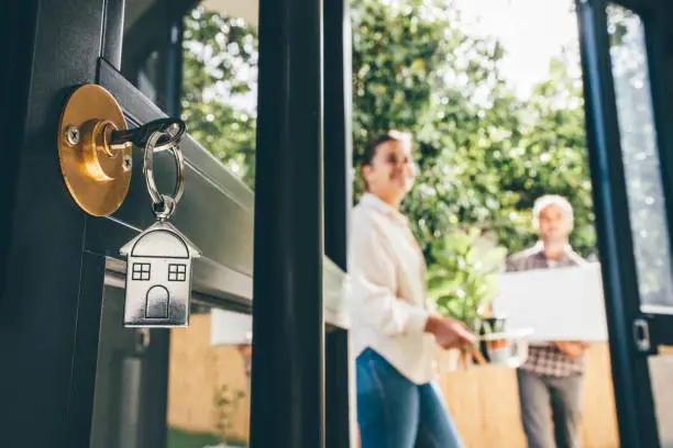 Couple Celebrating Moving Day Mortgage And Relocation Concept