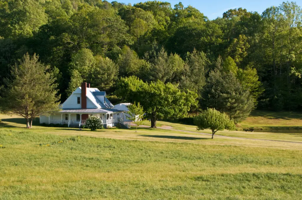 A Farmhouse With A Wrap Around Porch In A Secluded Valley In Western Virginia