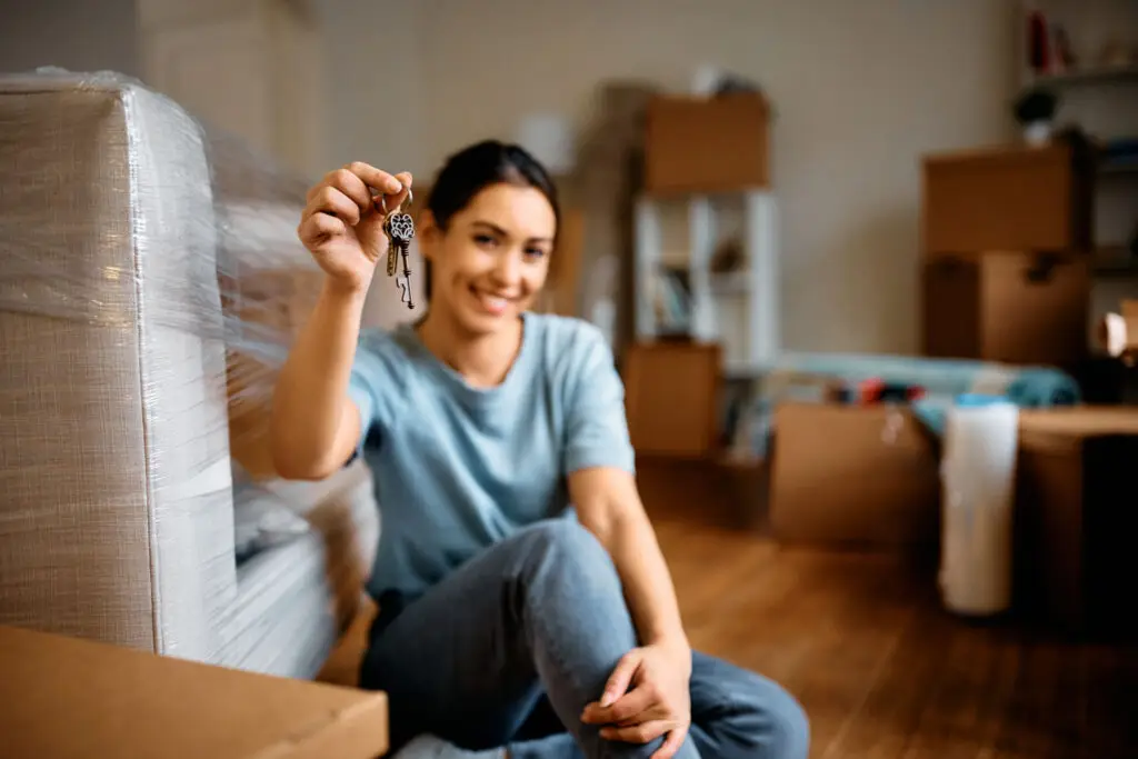 Close Up Of Woman With A Key Of Her New Apartment